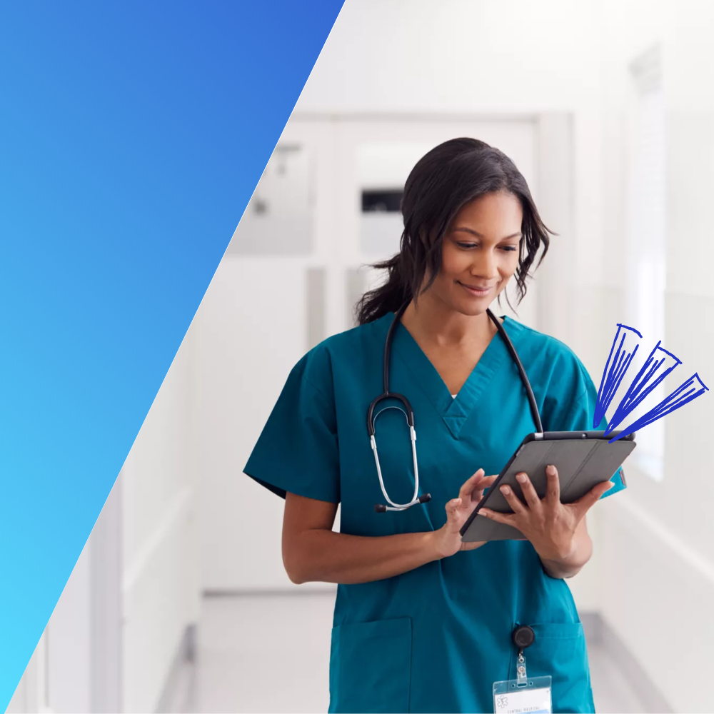 Female doctor wearing scrubs in hospital corridor using digital tablet working an in-demand healthcare job