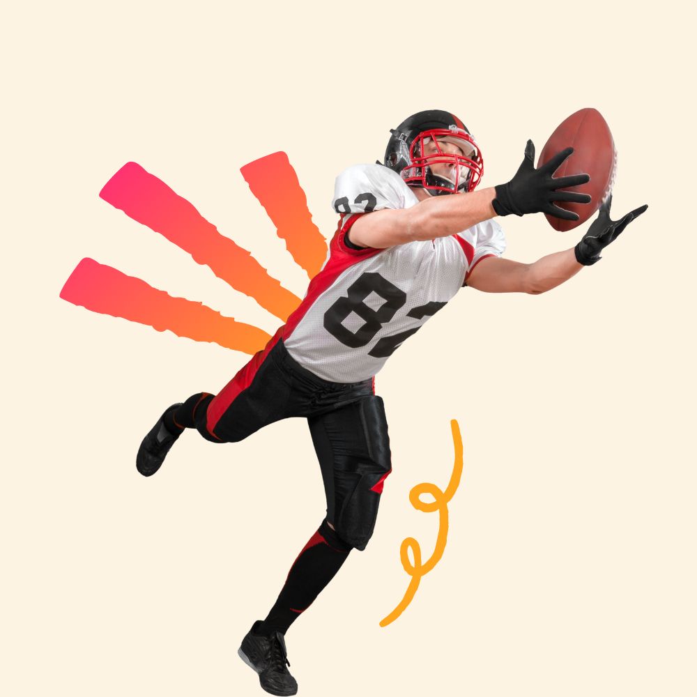 A football player wearing a red and white uniform with the number 83 leaps into the air, fully extended, to catch a football.