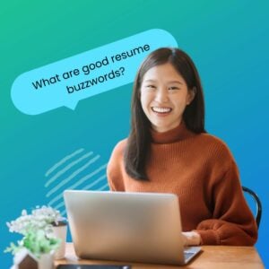 Young Asian American female student sitting at a desk typing on her laptop smiling with a speech bubble that reads, "What are some good resume buzzwords?"